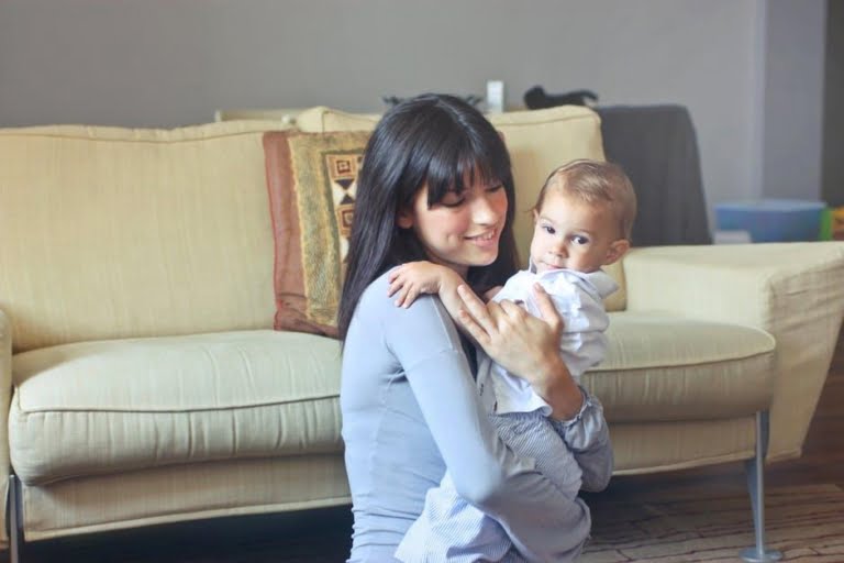 Woman in Gray Sweater Carrying Toddler in White Button-up Shirt